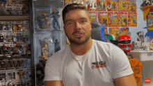 a man wearing a white t-shirt that says x-men on the front