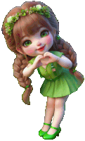 a little girl wearing a green dress and green shoes making a heart shape with her hands