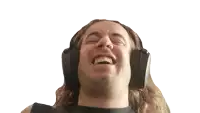 a man with long hair is wearing headphones and making a funny face