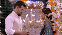 a man and a woman are standing next to each other