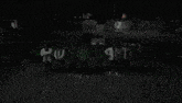 a green glowing object in the dark with a black background