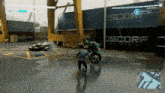 a video game is being played in front of a container that says oscorp on it
