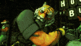a tiger playing drums in front of a sign that says evans