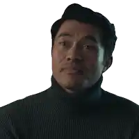 a man wearing a black turtleneck sweater is looking at the camera