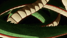 a close up of a snake 's tail with a black background