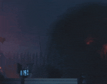 a large explosion is taking place in a dark room with a sign that says ' a ' on it