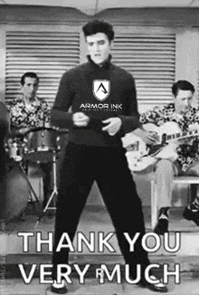 elvis presley is wearing an armor ink shirt and is dancing in front of a band