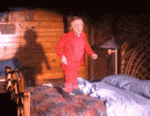 a man in a red suit standing on a bed