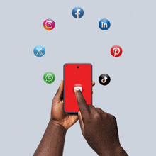 a person holding a cell phone with social media icons floating around them