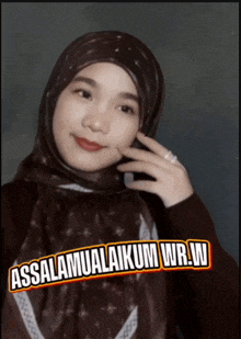a woman wearing a hijab with the words assalamualaikum wr.w. on the bottom right