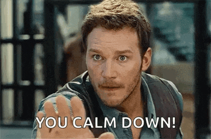 a man with a beard is making a funny face and says `` you calm down '' .