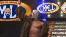a man in a wrestling mask is standing in front of a sign that says cmll