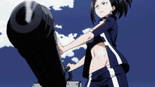 a girl in a crop top is holding a cannon