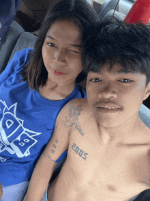 a shirtless man with the year 2005 on his chest