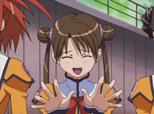 a girl with pigtails is making a funny face with her eyes closed