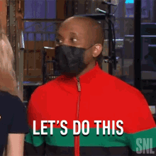 a man wearing a mask says let 's do this while talking to a woman