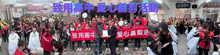 a group of people holding signs with chinese writing