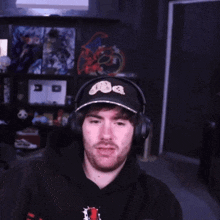 a man wearing headphones and a hat that says nba on it