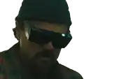 a man wearing sunglasses stands in front of a sign that says " courage yeah "