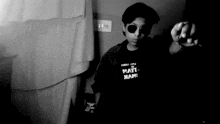 a black and white photo of a person wearing a shirt that says " may ham "