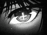 a close up of a person 's eye with a cross in the middle