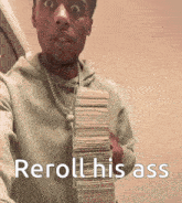 a man in a hoodie is holding a stack of money and says reroll his ass .
