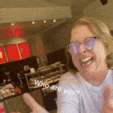 a woman wearing sunglasses is giving a thumbs up and says who are you