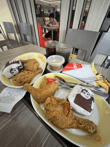 a jollibee meal with fried chicken french fries and a jollibee sandwich