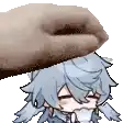 a person is petting a cartoon character 's head with a finger .