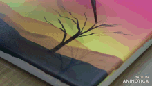 a painting of a tree on a canvas is made in animatica