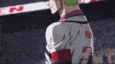 a man with green hair is wearing a jersey with the letter r on it