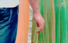 a blurry picture of a person 's hand holding a bottle of wine