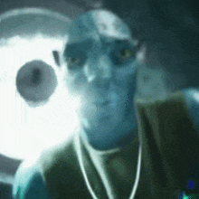 a close up of a man 's face with a glowing light behind him