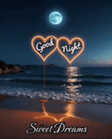a good night sweet dreams greeting card with two neon hearts on the beach .
