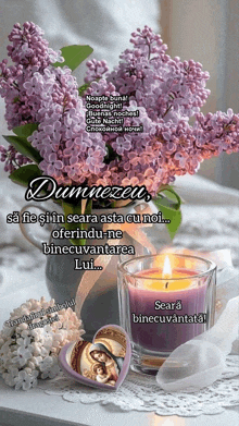 purple flowers in a vase next to a candle and a heart