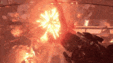 a person holding a gun in front of a fire