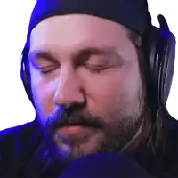 a man with a beard is wearing headphones and a headband with his eyes closed