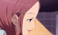 a close up of a girl with pink hair and a hair clip on her ear