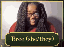 a picture of a woman with glasses and the name bree ( she / they )