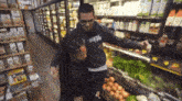 a man wearing a sweatshirt that says ' supreme ' on it is helping another man in a grocery store