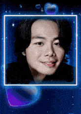 a picture of a young man in a blue frame with hearts around him