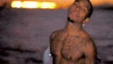 a shirtless man with a tattoo on his chest that says ' i love you ' on it