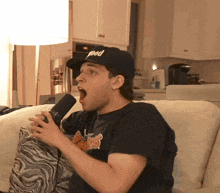 a man wearing a black hat that says pod on it