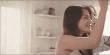 a man and a woman are dancing together in a room