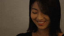 a close up of a woman 's face with a toothpick in her mouth