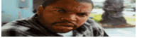 ice cube is making a funny face while looking at the camera .