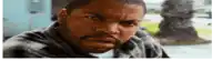 ice cube is making a funny face while looking at the camera .