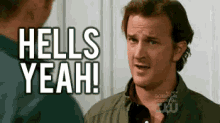 a man is talking to another man and says `` hells yeah '' .