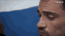 a close up of a man 's face with the words top chef on the bottom right
