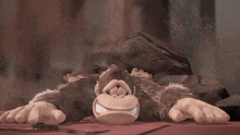a cartoon monkey is laying on the ground with his mouth open and his tongue sticking out